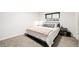Cozy bedroom with carpet, a comfortable bed, and a window providing natural light at 19661 E Girard Ave, Aurora, CO 80013