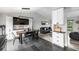 Open-concept room featuring dining table, living room, and kitchen all well-lit, spacious and nicely decorated at 19661 E Girard Ave, Aurora, CO 80013