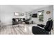 Bright living room with stylish furniture, large windows, and luxury vinyl plank flooring at 19661 E Girard Ave, Aurora, CO 80013
