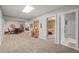 Spacious basement with a sitting area, games, and access to bedroom and bathroom at 20957 Horse Bit Way, Morrison, CO 80465