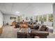 Finished basement with a comfortable seating area and windows providing natural light at 20957 Horse Bit Way, Morrison, CO 80465