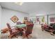 Finished basement featuring a game table with chairs, lounge area, and comfortable seating at 20957 Horse Bit Way, Morrison, CO 80465