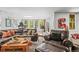 Finished basement featuring a seating area with comfortable seating, treadmill, and windows at 20957 Horse Bit Way, Morrison, CO 80465