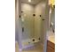 Modern bathroom featuring a glass enclosed shower with black hardware and contemporary fixtures at 20957 Horse Bit Way, Morrison, CO 80465