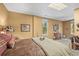 Warm bedroom featuring natural light, western-themed decor, and a cozy, inviting atmosphere at 20957 Horse Bit Way, Morrison, CO 80465