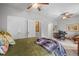 Bright bedroom featuring a workspace with a desk and chair, closet, and comfortable furnishings at 20957 Horse Bit Way, Morrison, CO 80465