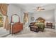Charming bedroom with a cozy bed, complemented by a vintage dresser and natural light from the windows at 20957 Horse Bit Way, Morrison, CO 80465