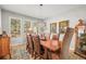 Dining room with an elegant light fixture, large windows, and seating for eight, perfect for gatherings at 20957 Horse Bit Way, Morrison, CO 80465
