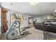 Open exercise room with plenty of space for workout equipment and seamless access to the living area at 20957 Horse Bit Way, Morrison, CO 80465