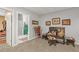 Cozy hallway with western decor leading to a bathroom with a large, green vanity at 20957 Horse Bit Way, Morrison, CO 80465