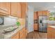 This kitchen has stainless steel appliances, light wood cabinets, and a granite countertop at 20957 Horse Bit Way, Morrison, CO 80465