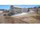 View of the backyard, featuring a white fence, patio area, and landscaped surroundings at 5367 Spring Ridge Trl, Castle Rock, CO 80104