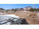 Large backyard featuring partial snow cover, a white fence, and elevated views of the neighborhood at 5367 Spring Ridge Trl, Castle Rock, CO 80104