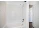 Bathroom featuring a tiled shower and a white door leading to another room at 5367 Spring Ridge Trl, Castle Rock, CO 80104