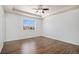 Spacious bedroom with tray ceiling, ceiling fan, and laminate flooring at 5367 Spring Ridge Trl, Castle Rock, CO 80104