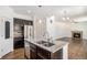 Stylish kitchen featuring an island with a sink, granite countertops, and stainless steel appliances at 5367 Spring Ridge Trl, Castle Rock, CO 80104