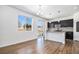 Eat-in kitchen features dark cabinets, granite countertops, and stainless steel appliances at 5367 Spring Ridge Trl, Castle Rock, CO 80104