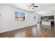 Open concept living room with hardwood floors and an adjoining kitchen area at 5367 Spring Ridge Trl, Castle Rock, CO 80104