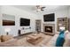 Inviting living room features a fireplace, hardwood floors, and ample natural light for a cozy atmosphere at 5367 Spring Ridge Trl, Castle Rock, CO 80104