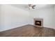 Spacious living room featuring a stone fireplace and hardwood flooring at 5367 Spring Ridge Trl, Castle Rock, CO 80104