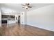 Open-concept living space with hardwood floors, kitchen view and ample natural light at 5367 Spring Ridge Trl, Castle Rock, CO 80104