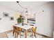 Bright dining area with a modern table, stylish chairs, and decorative accents for a welcoming atmosphere at 10311 E Evans Ave # 132, Aurora, CO 80247