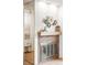 Close up of a stone fireplace with contemporary decor and a mirrored wall at 10311 E Evans Ave # 132, Aurora, CO 80247