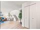 Living room with staircase, wood floors, neutral decor, and closet at 10311 E Evans Ave # 132, Aurora, CO 80247