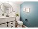 Stylish half-bathroom with elegant wallpaper, modern fixtures, and a clean, contemporary design at 10311 E Evans Ave # 132, Aurora, CO 80247