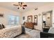 Spacious bedroom with natural light, neutral carpet, and access to a private balcony at 2855 Blue Sky Cir # 3-102, Erie, CO 80516