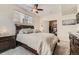 Well-lit primary bedroom boasts a ceiling fan, carpeting, and closet access at 2855 Blue Sky Cir # 3-102, Erie, CO 80516