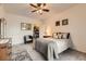 Cozy bedroom with neutral carpet, ceiling fan, and a walk-in closet for ample storage space at 2855 Blue Sky Cir # 3-102, Erie, CO 80516