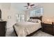 Comfortable bedroom with a ceiling fan, ample lighting, and access to the outside balcony at 2855 Blue Sky Cir # 3-102, Erie, CO 80516