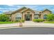 Well-maintained community clubhouse with stone accents, large windows, and manicured landscaping at 2855 Blue Sky Cir # 3-102, Erie, CO 80516