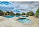 Inviting community pool area featuring a hot tub, pool, sundeck, and comfortable lounge chairs at 2855 Blue Sky Cir # 3-102, Erie, CO 80516