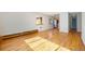 Living room showcases hardwood floors and leads into the kitchen area at 1144 N Ogden St # 304, Denver, CO 80218