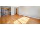 Open-concept living area with hardwood floors, seamlessly connected to the kitchen at 1144 N Ogden St # 304, Denver, CO 80218