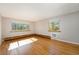 Sunlit living room with hardwood floors and large windows offering pleasant views at 1144 N Ogden St # 304, Denver, CO 80218