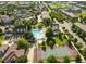 An aerial view of neighborhood amenities, showcasing a pool, tennis and basketball court, and a clubhouse at 11687 Newton St, Westminster, CO 80031