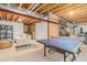 Unfinished basement with exposed ceiling and ping pong table ready for your personal touch at 11687 Newton St, Westminster, CO 80031