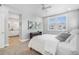 Primary bedroom with ensuite bathroom, large window, and lots of natural light at 11687 Newton St, Westminster, CO 80031