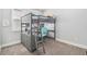 Bedroom with gray bunk bed that features a built-in desk and shelving, perfect for study and sleep at 11687 Newton St, Westminster, CO 80031