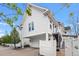 Exterior view of a home with a two-car garage and elevated patio, providing privacy at 11687 Newton St, Westminster, CO 80031