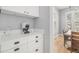 A kitchen nook provides a coffee machine, storage and natural light at 11687 Newton St, Westminster, CO 80031