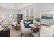 Cozy living room with a blue sofa, modern decor, and ample natural light, creating a comfortable space at 11687 Newton St, Westminster, CO 80031
