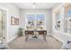 Bright office space with large windows, modern desk, and neutral decor at 11687 Newton St, Westminster, CO 80031