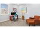 Bright home office space featuring a modern desk, comfortable seating, and natural light from a large window at 11687 Newton St, Westminster, CO 80031