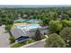Aerial view of neighborhood amenities, including a pool, tennis courts, playground, and clubhouse at 5643 S Fulton Way, Greenwood Village, CO 80111