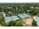 Aerial view of a neighborhood featuring tennis courts, a sand volleyball court, and a swimming pool at 5643 S Fulton Way, Greenwood Village, CO 80111