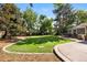 Lush green backyard featuring a neatly manicured lawn and attractive landscaping at 5643 S Fulton Way, Greenwood Village, CO 80111